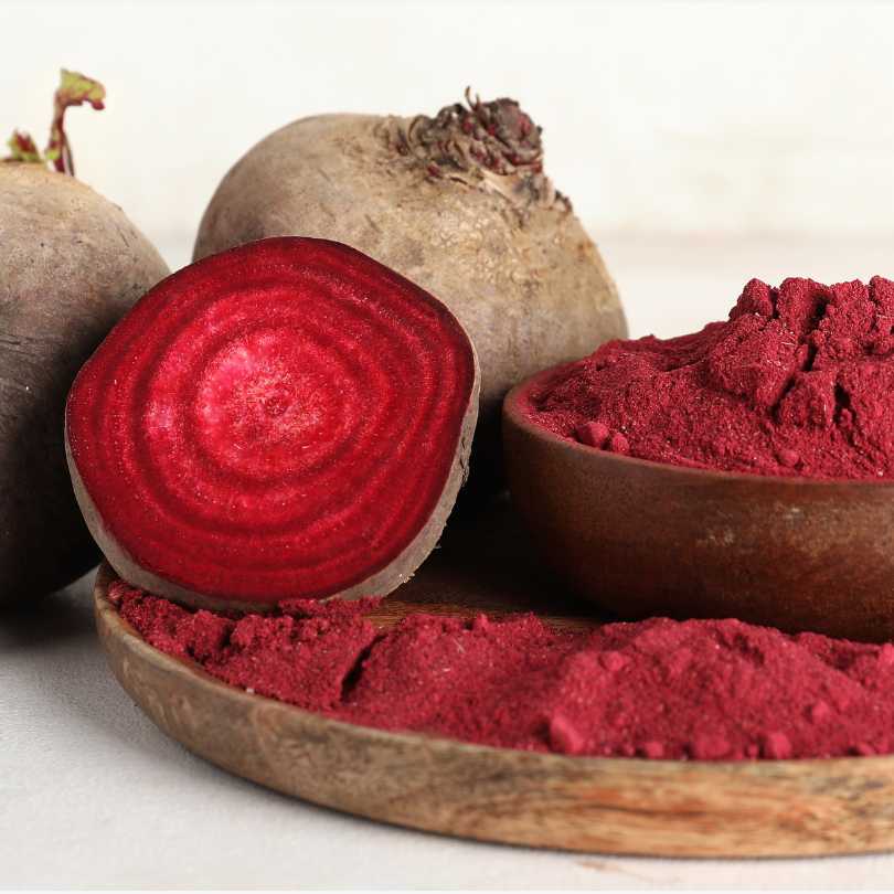 Beetroot and beetroot powder on a white background