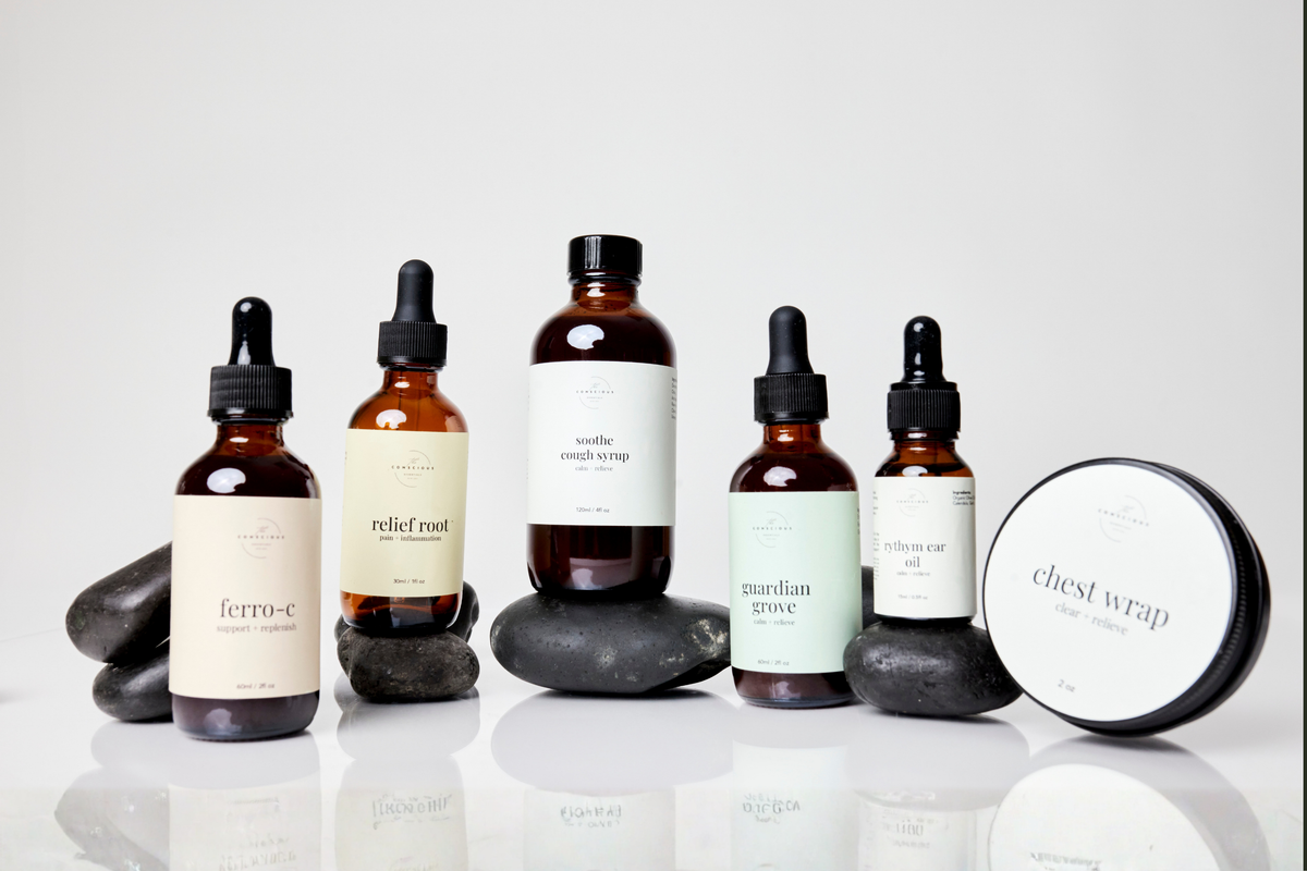 Collection of natural remedy bottles and a chest wrap on a white background. Products from the Conscious Essentials