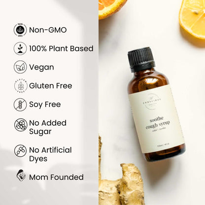 Bottle of cough syrup with ginger root and orange slices on a white background, featuring health benefits text.