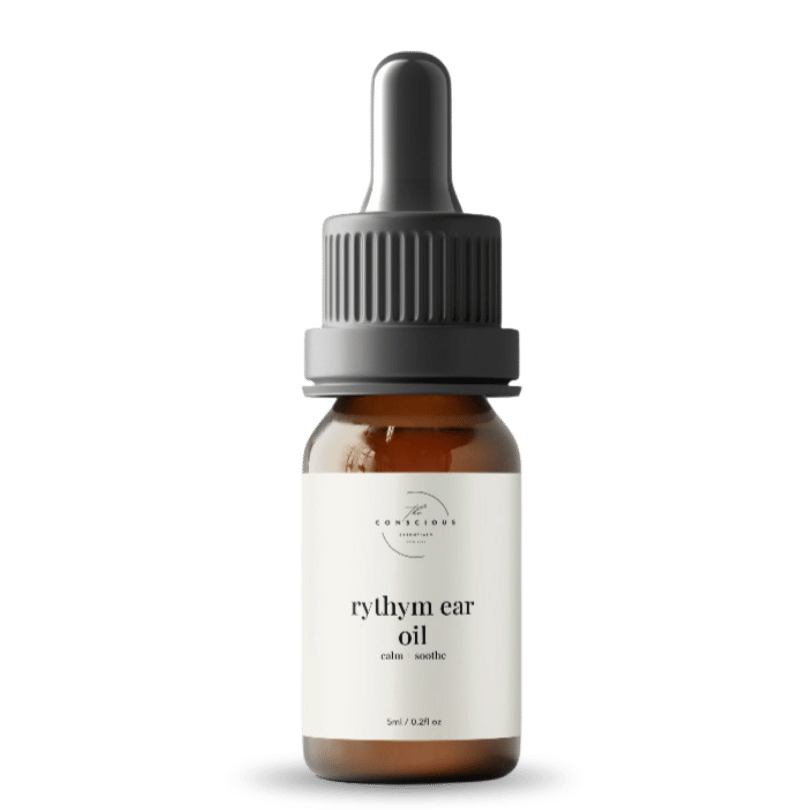 Bottle of rythym ear oil with a dropper on a white background