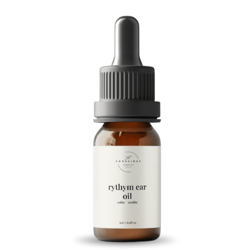 Bottle of rythym ear oil with a dropper on a white background